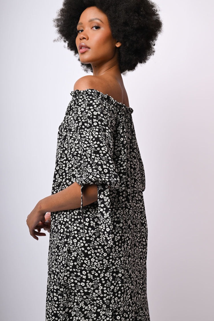 Blusa con spalle scoperte e stampa floreale