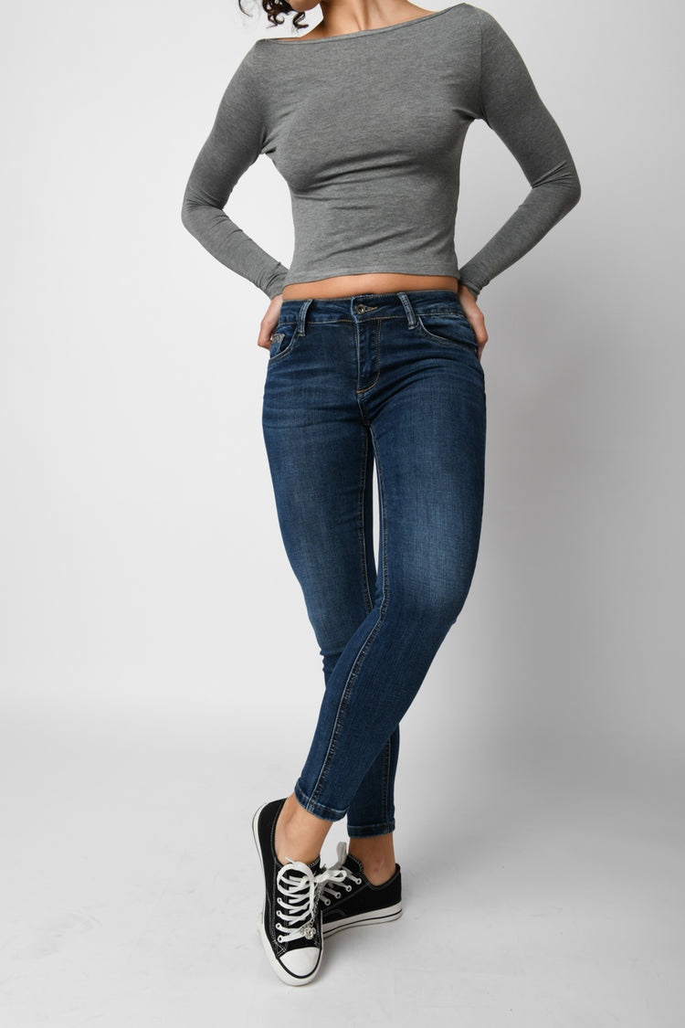 Jeans skinny con strass sulle tasche