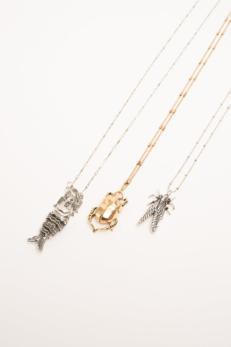 Set di tre collane con ciondoli Scarabeo oro e argento