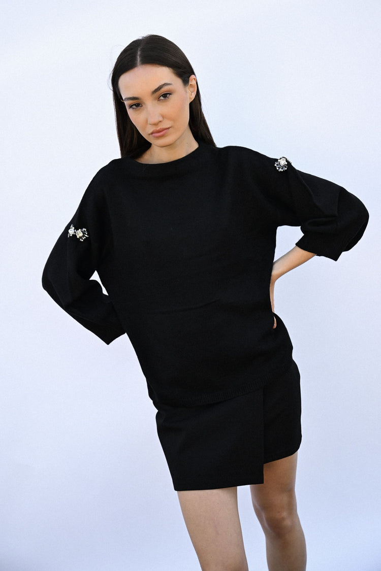 Pull con decorazioni gioiello