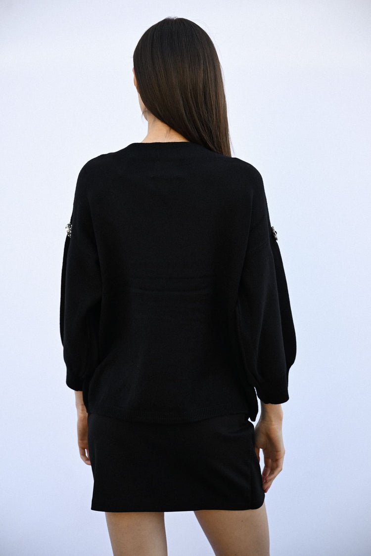 Pull con decorazioni gioiello