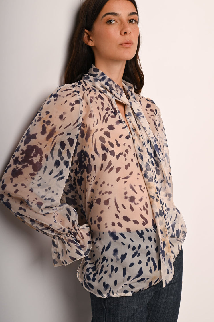 Blusa a stampa astratta con fiocco