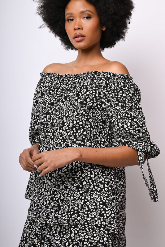 Blusa con spalle scoperte e stampa floreale