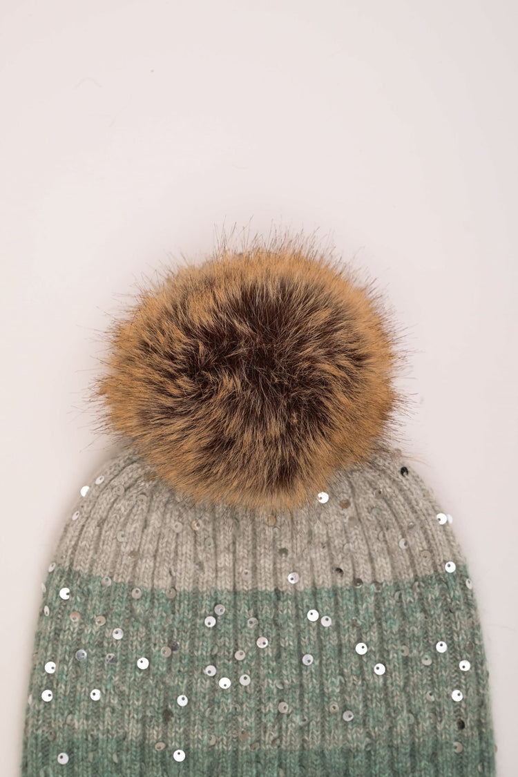 Berretto color-block con paillettes e pompon