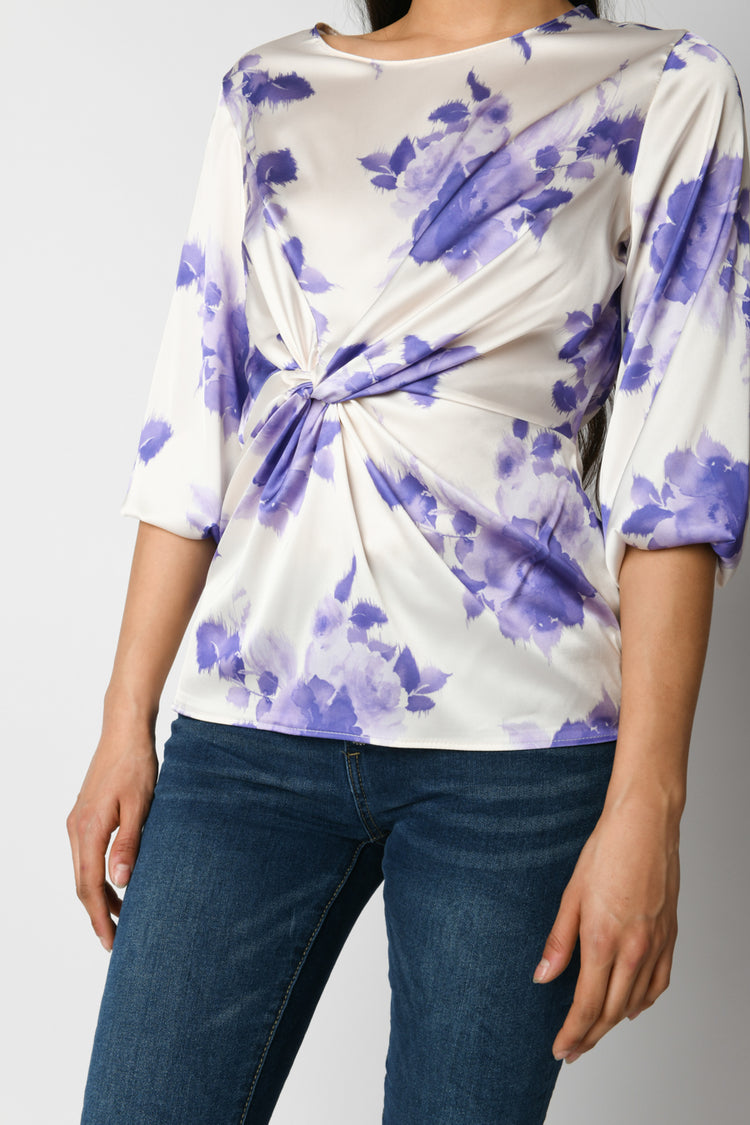 Blusa con nodo e stampa floreale