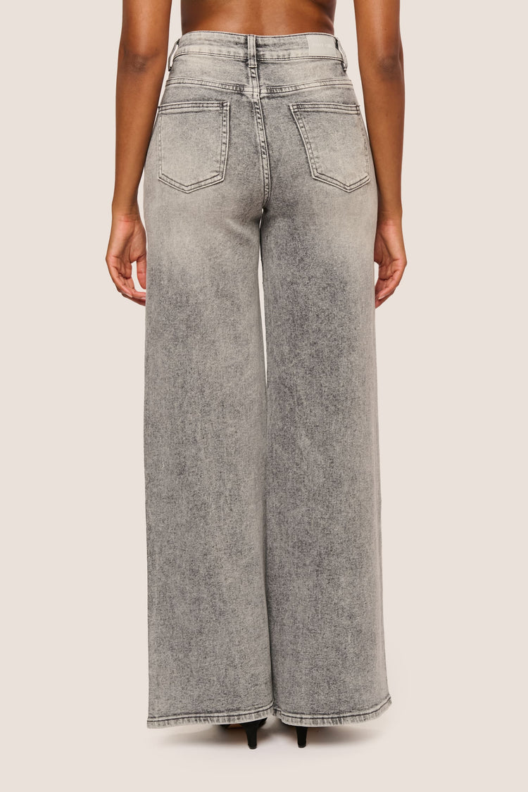 Jeans palazzo con mini borchie