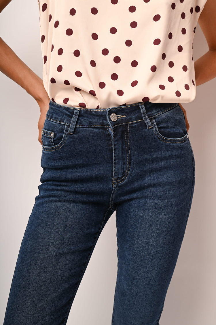 Jeans skinny con bottone gioiello