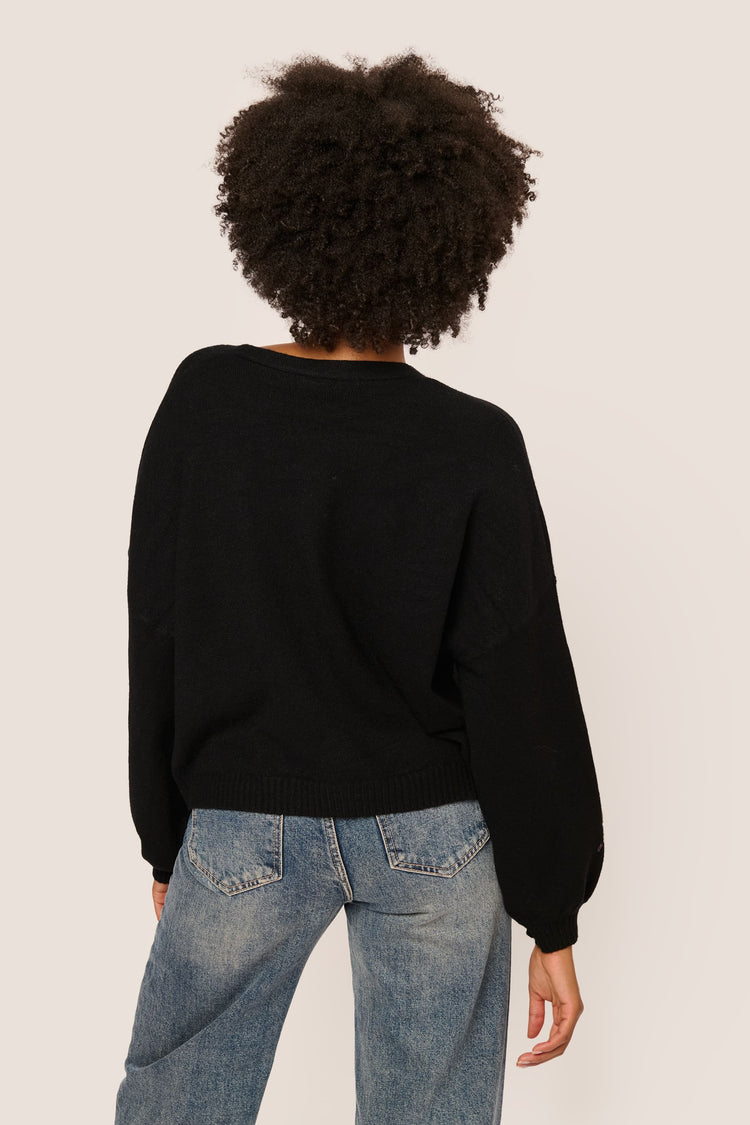 Cardigan con fiocchi in paillettes