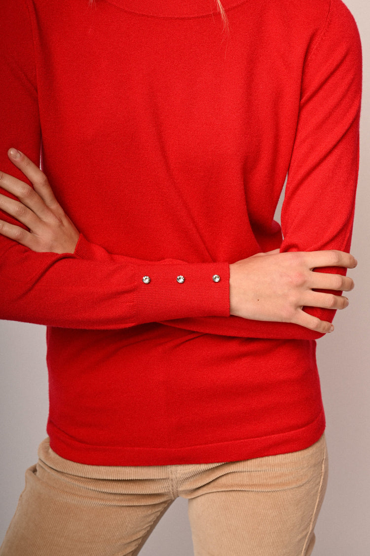 Pull con strass ai polsini