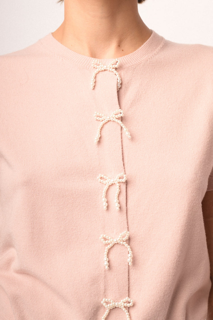 Cardigan rosa a maniche corte con fiocchi di perline