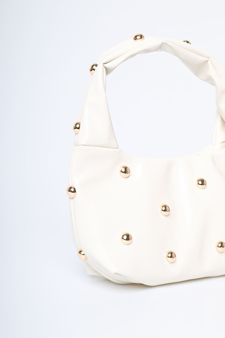 Borsa piccola a mezzaluna con borchie