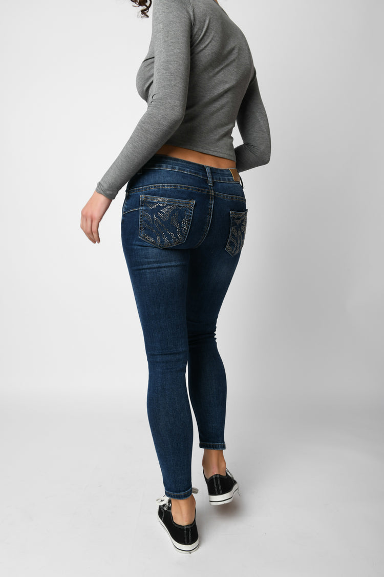 Jeans skinny con strass sulle tasche