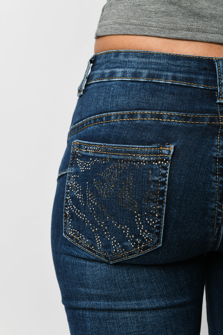 Jeans skinny con strass sulle tasche